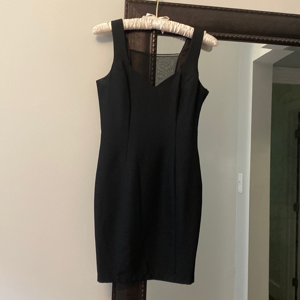 Black dress sleeveless with sheer on back.